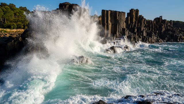 Wvaes of the Ocean crashing on to basalt rocks at Bombo Quarry