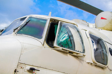 Fototapeta na wymiar Helicopters on a landing site against a blue sky