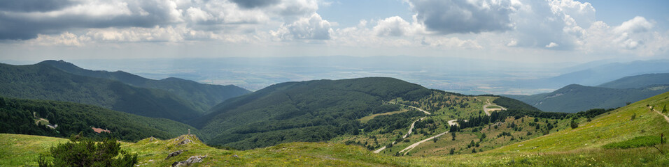 Fototapeta na wymiar Panoramic view of Shipka Pass from Buzludzha Peak. Shipka Pass - a scenic mountain pass through the Balkan Mountains in Bulgaria.