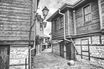 City landscape, in black-and-white color - view of the old streets and homes in balkan style, the Old Town of Nesebar, in Burgas Province on the Black Sea coast of Bulgaria