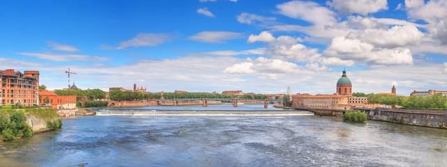 Summer city landscape, panorama, banner - view of the Garonne river in the city of Toulouse, in the historical province Languedoc, the region of Occitanie of southern France - obrazy, fototapety, plakaty