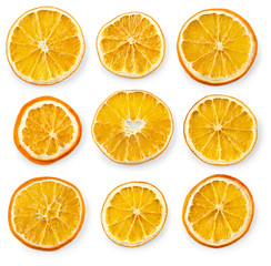 Set of dried slices and half a slice of orange and lemon, isolated on white background
