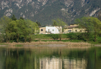 Obraz premium Lake in northern Italy, LAKE OF IDRO, border between lombardia and trentino, stunning view of lake in spring time