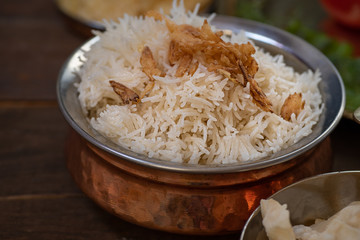 Basmati rice fried with ghee, topped with crispy onions