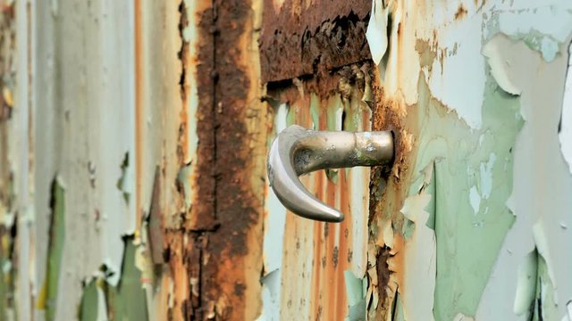 The lock of the white rusty van from the garage
