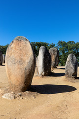 Granite standing stone, menhir, with other megalithic and neolithic standing stones at the...