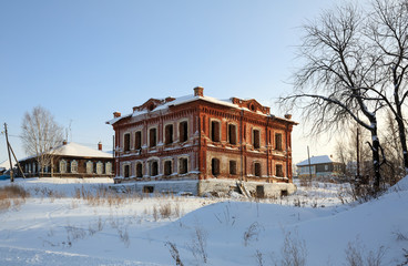 Fototapeta na wymiar Abandoned historical residential house in winter. Village of Visim, Sverdlovsk region, Russia