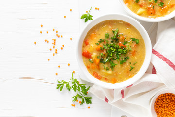 Vegetarian vegetable lentil soup with fresh parsley, healthy eating, top view