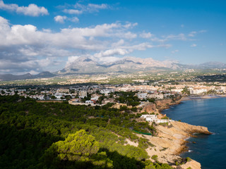 Fototapeta na wymiar aerial view of coastal town with beach and mountains