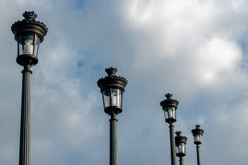 Fototapeta na wymiar old street lamps on blue sky