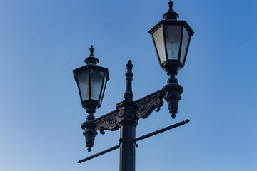 Fototapeta na wymiar vintage street lamps on blue sky background