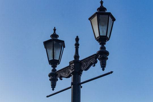vintage street lamps on blue sky background