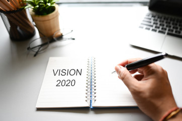 VISION 2020 word on the notebook Business Concept