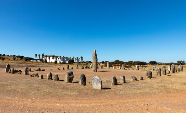Xarez stone circle (Cromeleque do Xerez), a standing stone quadrant near Monsaraz, Portugal with Convento da Orada in background