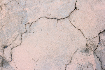 Obraz premium Concrete wall with cracks and old damaged paint. Texture and background