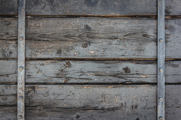Old  black shabby wooden background with rusty metal