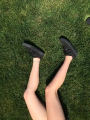 legs on green grass
