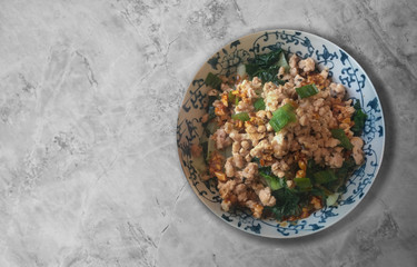 Homemade Dandan noodles on marble surface.