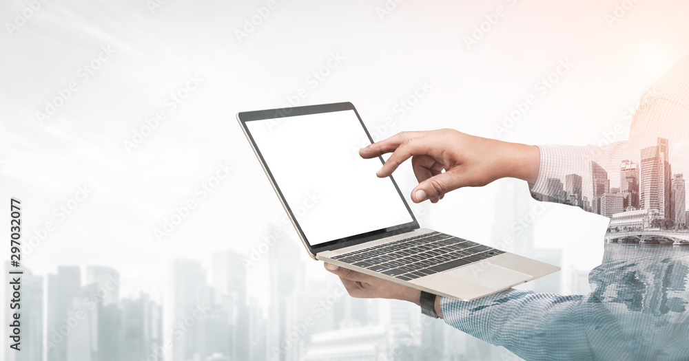 Poster double exposure image of businessman using computer on abstract modern city background. future busin