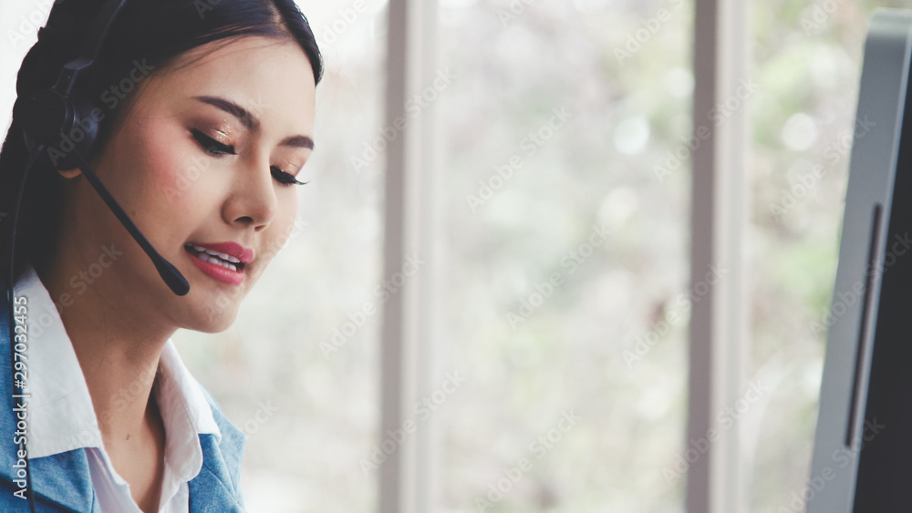 Aufkleber customer support agent or call center with headset works on desktop computer while supporting the cu