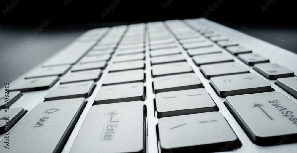 Wall mural close-up soft-focus laptop computer keyboard. programming and online marketing business concept.