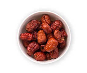 dried chinese red jujube in the white bowl isolated on white background, top view, flat view