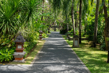 Pathway through the landscaped gardens of a tropical resort in Bali Indonesia