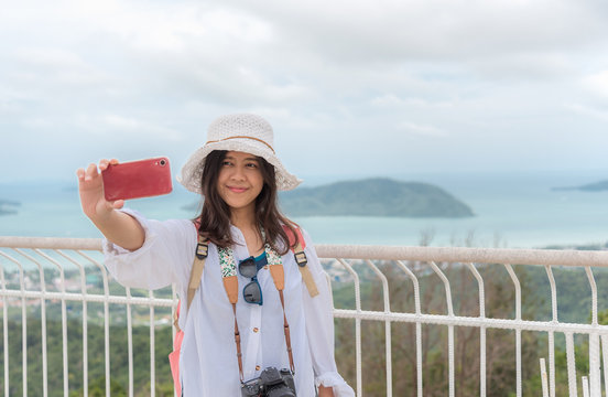 Asian traveler woman selfie at view point in Phuket Thailand.