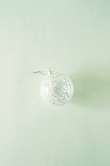 Christmas background. Xmas or new year white ball decoration on pastel blue background top view . toned. minimal concept