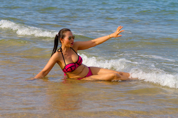 Woman and bikini pink injoy on beach