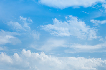 Blue sky with white clouds. Sunlight. Bright sky. Good weather. There was light shining from the clouds.