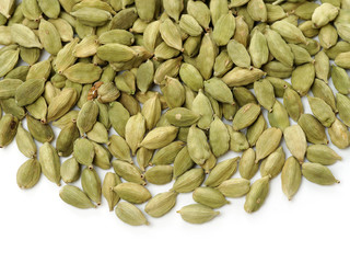Green cardamom pods on white background