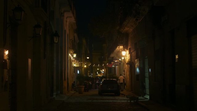 Busy Old Havana street at night.