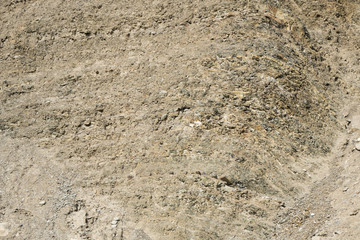 Sedimentary rock of compressed sand. Background. Texture.