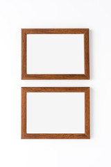 Two wooden picture frames isolated on white background. Mockup with copyspace