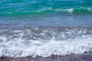 Soft wave of sea on sandy beach. Background.