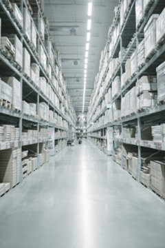 Warehouse industry blur background with logistic wholesale storehouse, Products on shelf.