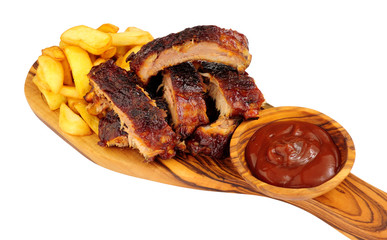 Grilled mini pork ribs and French fries on a wooden serving board isolated on a white background
