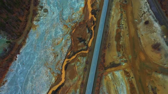 ecological disaster with an apocalyptic landscape of bright yellow-red color, dead soil, chemical waste of a copper smelter, the dirtiest place in the world, Karabash, Russia, Ural. Environmental
