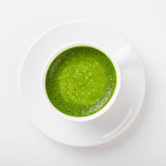 Matcha green tea latte with coconut milk. Top view.	