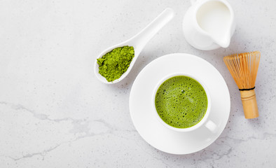 Matcha green tea latte with coconut milk. Top view.	