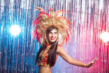 Holidays, party, dance and nightlife concept - Beautiful woman dressed for carnival night