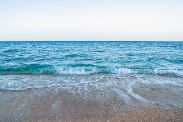 yellow warm sand and summer sea with sky and free space. Tropical beach scenery background with copyspace
