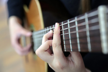 closeup of guitar player's hand