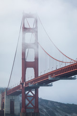Golden gate bridge covered by cloud