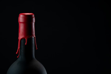 Set of collars red wine bottles isolated on black background