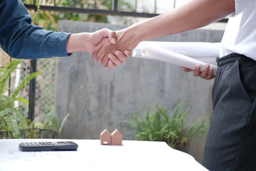 architect shaking hands after meeting. engineer handshaking after conference. teamwork partnership cooperate concept.