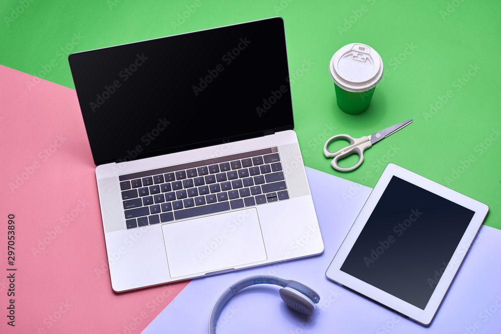 Aufkleber blank notebook page on pastel colored background office desk with different objects