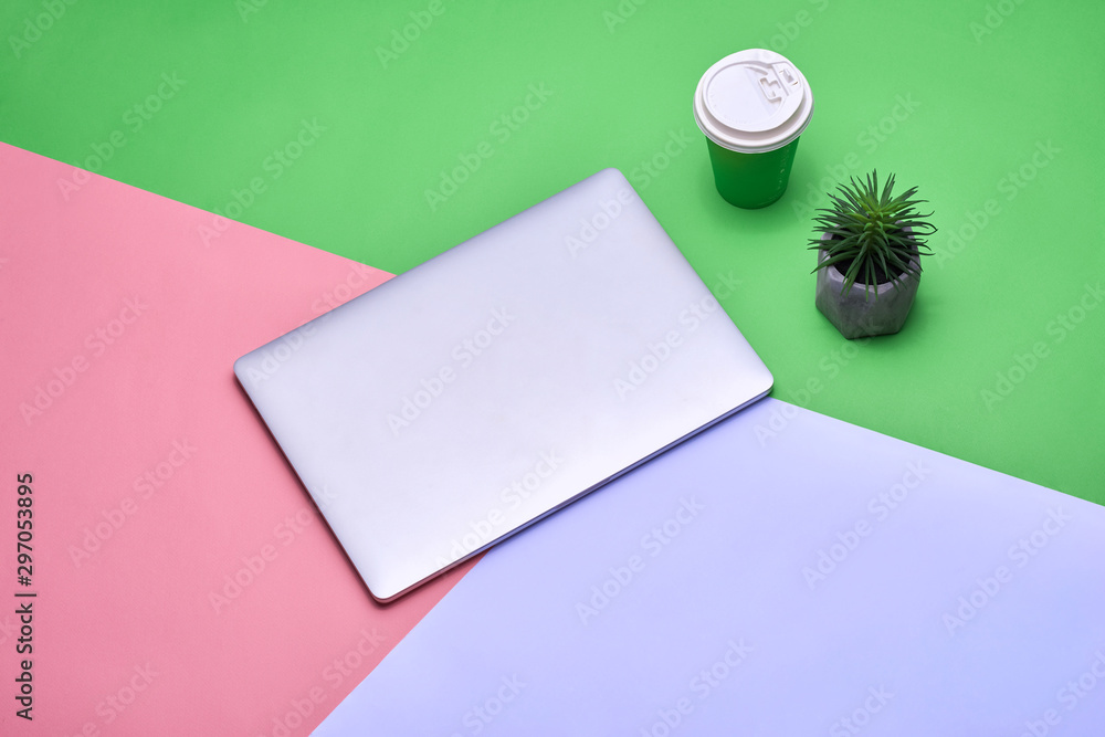 Poster blank notebook page on pastel colored background office desk with different objects
