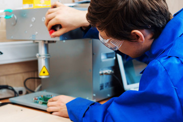 the engineer employee working process on the machine factory